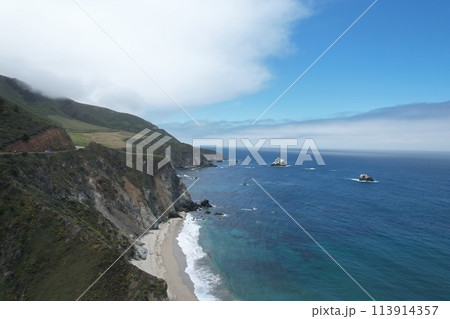 Windswept cliffs and Pacific ocean from Highway one Calfifornia Windswept cliffs and Pacific ocean from Highway one Calfifornia 113914357
