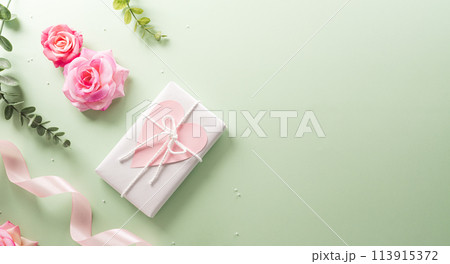 Happy Mother's day and Women's Day decoration concept made from flower and gift box on pastel background. Happy Mother's day and Women's Day decoration concept made from flower and gift box on pastel background. 113915372
