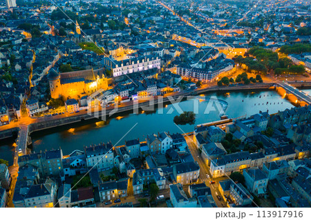Evening aerial view of Laval with buildings, river Mayenne and old bridge 113917916