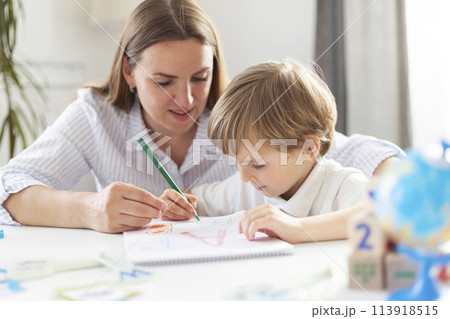 Mother Teaching Child Drawing at Home 113918515