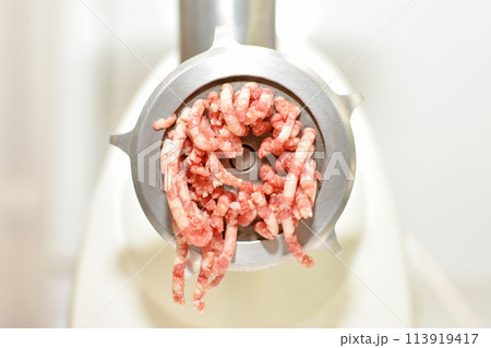 minced meat production process in an electric meat grinder minced meat production process in an electric meat grinder 113919417