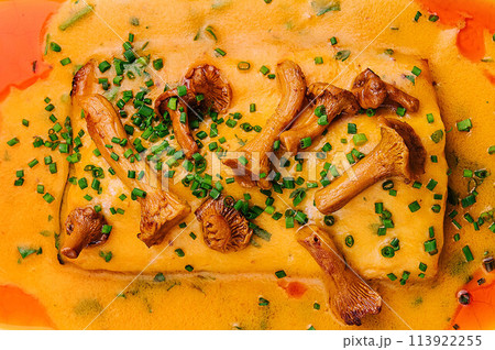 lasagna with chanterelle mushrooms in yellow sauce 113922255