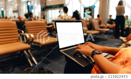 A laptop with blank screen on chair at airport A laptop with blank screen on chair at airport 113922453