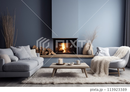 a beautiful fireplace and sofa in the living room 113923389