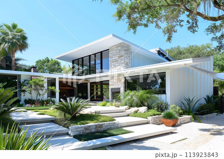 Modern house with gable roof and stone front garden, the essence of a classic yet simple architectural style. 113923843