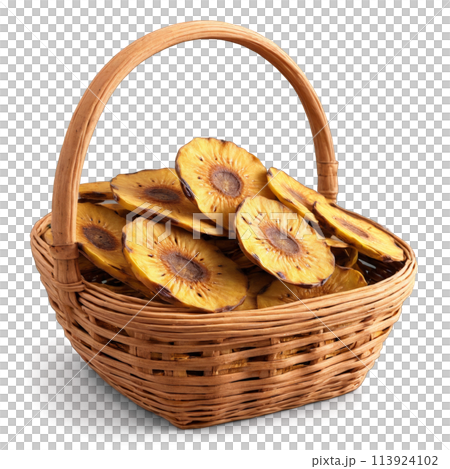 Dried plantain slices in a rustic wicker basket light brown with a starchy texture 113924102