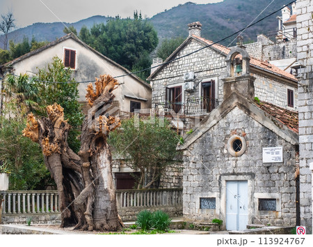 Prcanj in the Bay of Kotor, ancient buildings on the coastal street 113924767