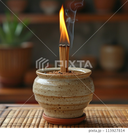 lit incense stick relaxed atmosphere 113927814