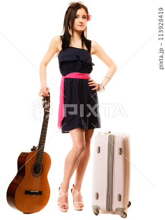 Music lover, summer girl with guitar and suitcase Music lover, summer girl with guitar and suitcase 113928419