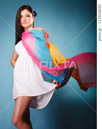 summer woman with colored shawl on blue 113928650