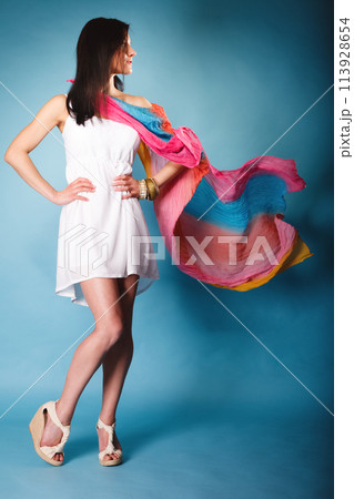summer woman with colored shawl on blue summer woman with colored shawl on blue 113928654