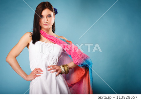 summer woman with colored shawl on blue 113928657