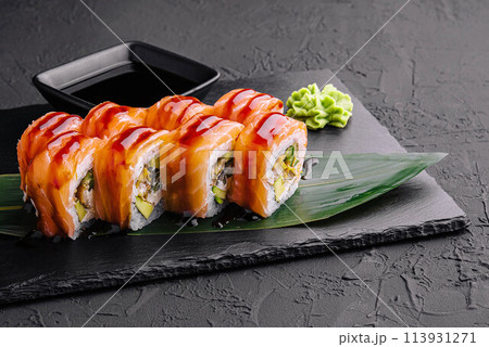 Delicious philadelphia sushi on black stone plate Delicious philadelphia sushi on black stone plate 113931271