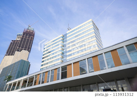 Low angle view of Jakarta city building corner against clear blu sky. 113931312