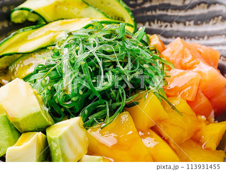 poke bowl with salmon close up poke bowl with salmon close up 113931455