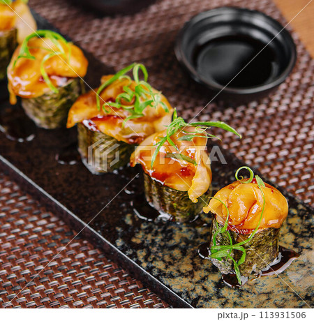 Salmon sushi temaki on black plate Salmon sushi temaki on black plate 113931506