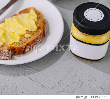 bread and melted butter for breakfast 113931538