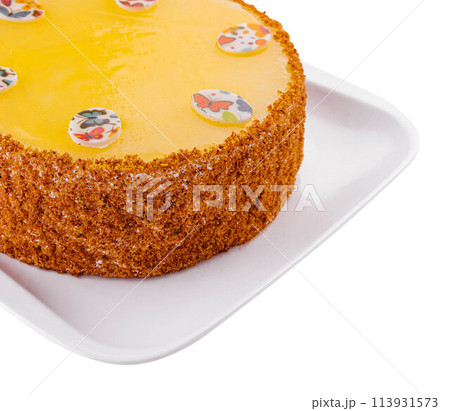 Carrot cake in yellow glaze on plate Carrot cake in yellow glaze on plate 113931573