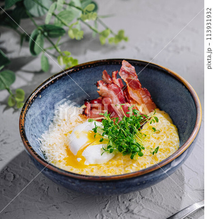 oatmeal porridge with poached egg and bacon oatmeal porridge with poached egg and bacon 113931932
