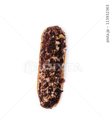 eclair with chocolate and nuts on a white eclair with chocolate and nuts on a white 113932363