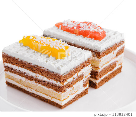 two slices of multilayer cocoa sponge cake with coconut flakes two slices of multilayer cocoa sponge cake with coconut flakes 113932401