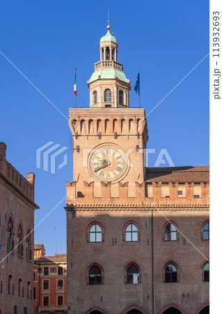 Sunlight on the clock tower of Bologna Palazzo d'Accursio 113932693
