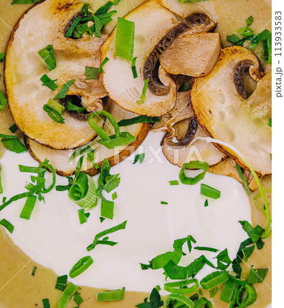 Mushroom cream soup in a bowl close up Mushroom cream soup in a bowl close up 113933583
