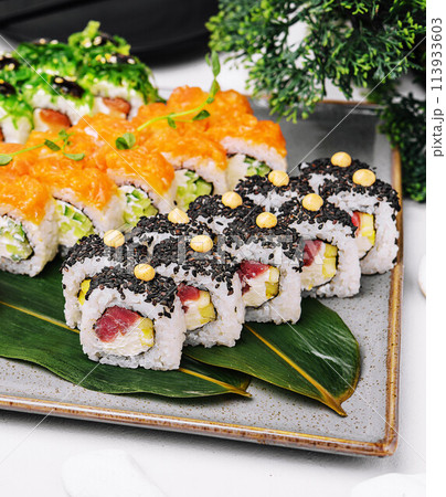 three different types of sushi rolls 113933603
