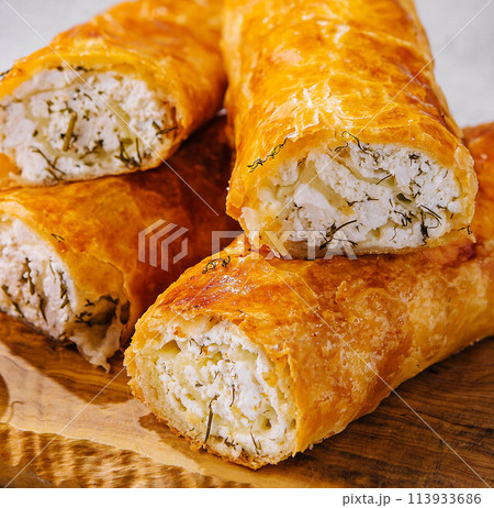 Cooking traditional pies with cottage cheese on wooden table 113933686