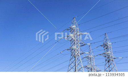 High voltage tower against the sky. Power transmission tower with wires High voltage tower against the sky. Power transmission tower with wires 113934505