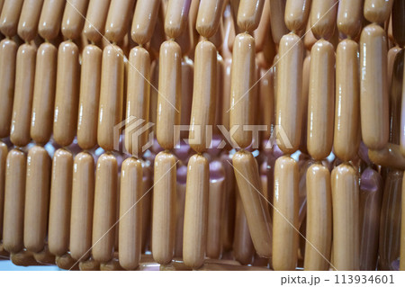 Production of meat sausages. Meat factory and industry. 113934601