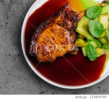 grilled steak with zucchini and Brussels sprouts 113934740