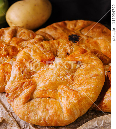 Cooking traditional pies with potatoes close up 113934799
