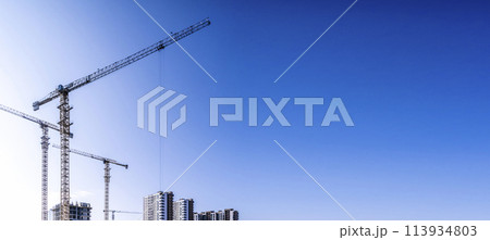 Construction industry building. Construction industry site with cranes, fittings and concrete. Construction industry building. Construction industry site with cranes, fittings and concrete. 113934803