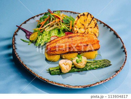 roast salmon steaks and shrimps with boiled asparagus roast salmon steaks and shrimps with boiled asparagus 113934817