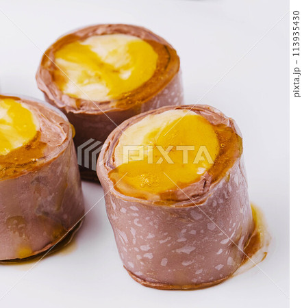Chocolate Banana Pancake Rolls on White Plate 113935430
