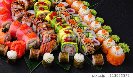 Large sushi set on a black stone Large sushi set on a black stone 113935572