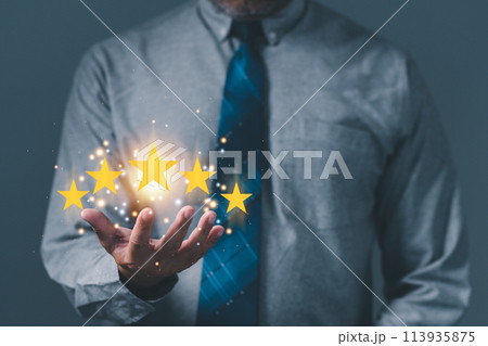 hand of customer or businessman holding stars to complete five stars for satisfaction service mind. he smiles and is happy before giving five star rating. Service rating, satisfaction concept. hand of customer or businessman holding stars to complete five stars for satisfaction service mind. he smiles and is happy before giving five star rating. Service rating, satisfaction concept. 113935875