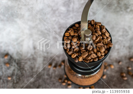hand manual coffee grinder for espresso is antique, coffee business of vintage, closeup and selective focus, copy space 113935938