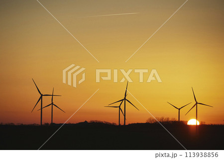 Wind turbines in the Danish countryside at sunset 113938856