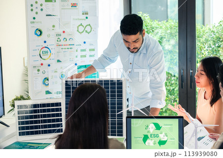 Diversity team presentation new design solar cell panel renewable energy innovation at office Diversity team presentation new design solar cell panel renewable energy innovation at office 113939080