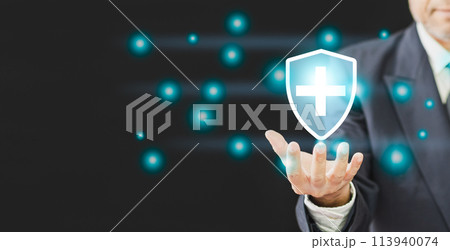 A man is holding a shield with a cross on it 113940074
