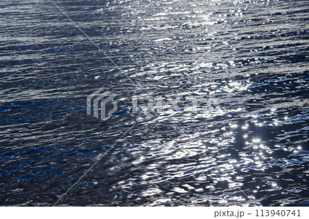 Shiny deep blue sea water with bright reflections, natural background Shiny deep blue sea water with bright reflections, natural background 113940741