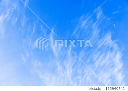White clouds in blue sky on a windy day, natural background texture White clouds in blue sky on a windy day, natural background texture 113940742