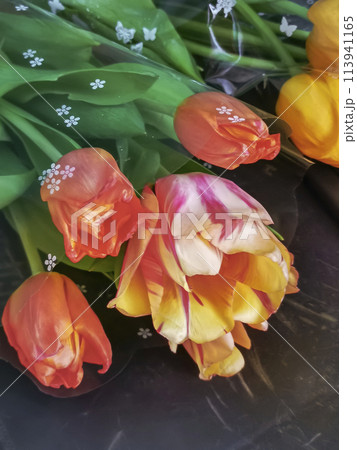 A bouquet of beautiful tulips on the table 113941165