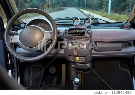 Shift lever, car steering wheel and sensors. Inside a modern car view, city car interior background Shift lever, car steering wheel and sensors. Inside a modern car view, city car interior background 113941489