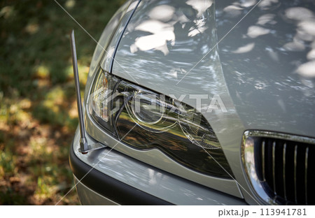 White car with a street background. Modern city car photo 113941781