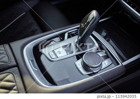 Car shift lever. Inside a modern car view, city car interior background 113942035