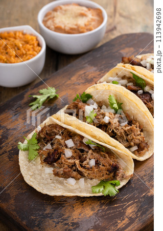 Pork carnitas tacos on a cutting board 113942698