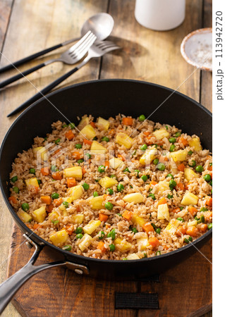 Pineapple fried rice with peas and carrots Pineapple fried rice with peas and carrots 113942720